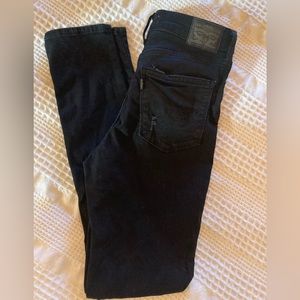Levi’s 721 High Rise Skinny jeans, 27x30, black and slightly distressed